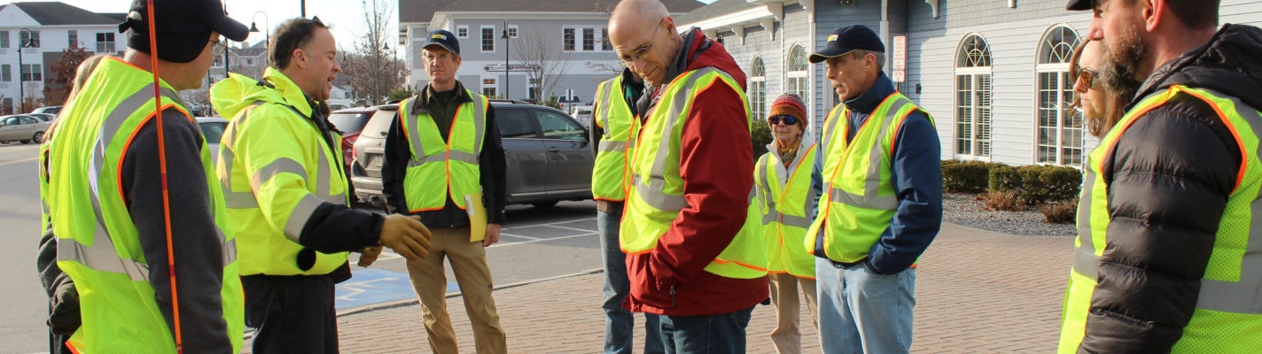 Group on sidewalk preforms walkability study image