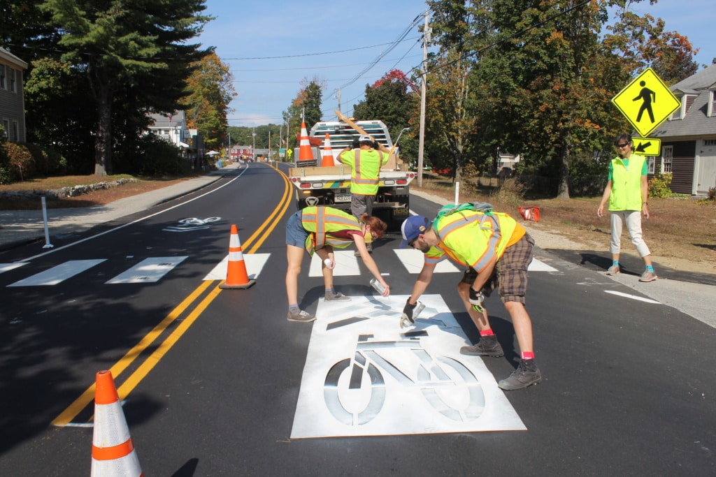 The BCM staff paints shared lane markings on street. 